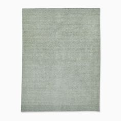 a light green rug on a white background with no one in it or someone else