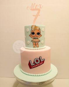 a pink and blue birthday cake with an image of a doll on the top tier