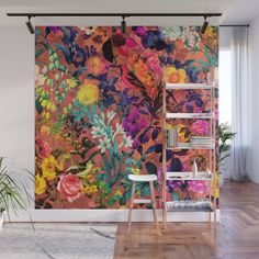 a colorful floral wall mural in a living room