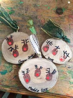 three wooden slices with christmas decorations on them