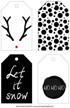 four tags with black and white designs on them, one has the words let it snow