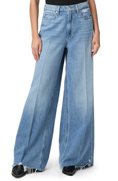 Made from supersoft and drapey denim, these vintage-inspired jeans feature the brand's highest waist and widest, longest legs to create a dramatic silhouette. 34 1/2" inseam; 28 1/2" leg opening; 12" front rise Zip fly with button closure Five-pocket style 60% cotton, 40% lyocell Machine wash, tumble dry Imported Light Wash Wide Leg Flare Jeans For Work, Wide Leg Light Wash Flare Jeans For Work, Classic Wide-leg Denim Bottoms, Chic Medium Wash Wide-leg Flare Jeans, Wide Leg Flare Jeans With Five Pockets, Classic Denim Wide Leg Pants For Spring, Chic Medium Flare Wide-leg Jeans, Classic Mid-rise Wide Leg Denim Pants, Classic Wide Leg Flare Jeans In Denim Blue