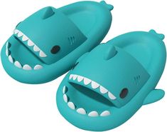 a pair of blue slippers with teeth on them