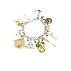 a harry potter charm bracelet with various charms on the front and back of it,