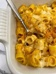 a white bowl filled with macaroni and cheese