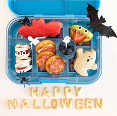 a bento box filled with halloween food and decorations for kids to eat on the go