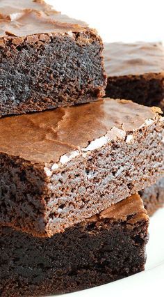 three pieces of chocolate cake on a white plate