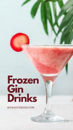 a frozen gin drink in a martini glass with a strawberry garnish on the rim