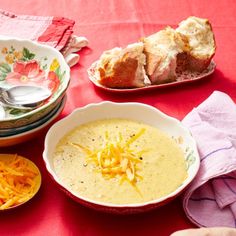 a table topped with bowls filled with soup and cheese