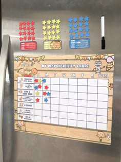 a stainless steel refrigerator with stickers on it