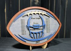 a football shaped plaque with the words your logo and an image of a football on it