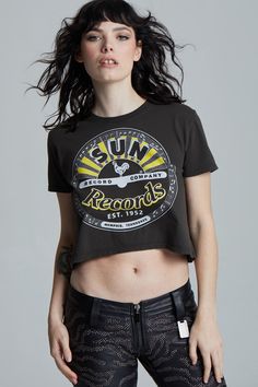 Go back to the beginning and see where rock 'n' roll was born! This Sun Records tee features their classic logo on the front, with "The Birth Of Rock 'N' Roll" on the back. Made with soft cotton fabric, a ribbed crew neckline, short sleeves, and a slightly fitted style. Details Style #302323 Color: Vintage Black Sun Records Rock 'N Roll Cropped T-Shirt 100% Cotton Care/Import Machine Wash Cold, Tumble Dry Low Designed and Finished in Los Angeles Measurements Model is wearing size S Height: 5'7" Sun Records, Fitted Style, Color Vintage, Classic Logo, Clothes Horse, Roll On, Crop Tshirt, Rock N, Crop Tee