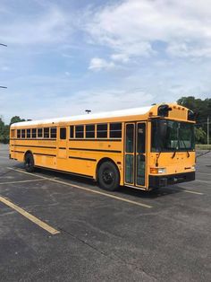 a yellow school bus parked in a parking lot