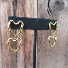 "90s gold tone modernist double heart dangle earrings. Stud backs. Light and comfy--one weighs more than a penny, less than a nickel.  They are 1-3/8\"  long x 11/16\" at widest part Nice and bright with no real flaws." Vintage Gold Double Heart Earrings, Gold Double Heart Vintage Earrings, Retro Gold Heart-shaped Earrings, Plain Outfits, Puffed Heart, Heart Dangle Earrings, Minimalist Gifts, A Penny, Double Heart