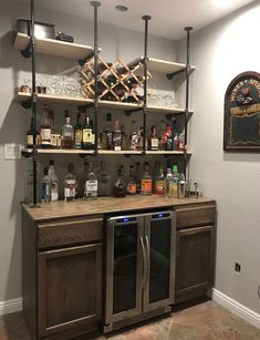 a home bar with wine bottles on the shelves