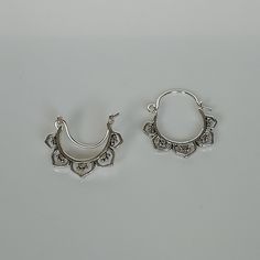 A PAIR of indian style sterling silver ear hoops. Size: 18 x 20 mm Price listed is for a pair of ear hoops. These earrings are made of 925 hypoallergenic sterling silver. All my pieces are sent in a gift box. I can include a personal message from you if needed. You are welcome to contact me at... bhavnakwintra1956@gmail.com More hoops: https://www.etsy.com/your/shops/TheSilverGame/tools/listings/section:26305414 More earrings: https://www.etsy.com/your/shops/TheSilverGame/tools/listings/section: Bohemian Small Hoop Pierced Earrings, Nickel Free Spiritual Hoop Earrings For Festivals, Bohemian Round Hoop Earrings For Everyday, Everyday Small Hoop Bohemian Earrings, Adjustable Spiritual Hoop Earrings For Festivals, Everyday Bohemian Hoop Earrings, Small Hoop Earrings For Festival, Small Hoop Hypoallergenic Earrings For Festivals, Bohemian Hypoallergenic Hoop Earrings For Festivals