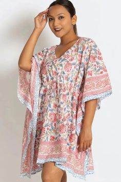 This soft cotton mini caftan makes a great swimsuit cover-up or comfy dress! Empire waist half sleeve women's mini caftan with v-neck is made of breezy, lightweight, 100% cotton. This caftan mini dress features an adjustable drawstring gather at the waist for whether you prefer a relaxed or fitted look. The material for this short caftan dress is hand block-printed by artisans in Rajasthan, India. The wooden blocks are first hand-carved and the design is then hand-stamped using a different block Bohemian V-neck Kaftan For Vacation, Summer V-neck Tunic For Loungewear, Beach V-neck Printed Kaftan, V-neck Floral Print Tunic For Beach Cover-up, White Printed V-neck Kaftan, V-neck Kaftan For Vacation, Summer V-neck Tunic For Vacation, Relaxed Fit V-neck Cover-up For Vacation, Printed V-neck Tunic