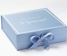 a blue box with a bow on the top that says, will you be my groomsman?