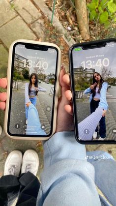 two people holding up their cell phones with pictures on them