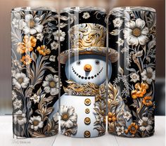 the snowman is made out of metal and has flowers on it, as well as an ornate design