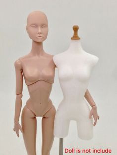 two mannequins standing next to each other in front of a white background