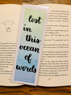 an open bookmark with the words lost in this ocean of words on it