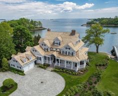 this is an aerial view of a house in the middle of a large body of water