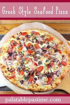 the greek style seafood pizza is ready to be eaten