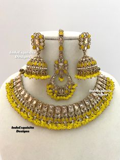 Antique Polki Necklace Set comes with Jhumki earrings and tikka / Indian Jewelry/ High Quality Kundan and Polki Jewelry/ Bollywood Jewelry/Wedding Jewelry/Yellow All items are shipped from Brampton, Ontario, Canada. If you need your item by a certain day, please reach out to us for express delivery option before placing the order so that we can update the shipping for you. Standard shipping/delivery timeline Below are the delivery timeline estimates once the order ia shipped ---> USA delivery timeline * 4-8 business days to major urban centers in USA. It may take 2-3 days extra to remote locations ---> Canada delivery timeline  * 2-3 business days - GTA  & Montreal  * 2-4  business days - Rest of Ontario/Quebec * 4-8 business days-  Rest of Canada    ---> Europe/Middle East timeline * 5-10 Yellow Chandbali Jewelry For Celebration, Temple Jewelry Style Bridal Necklace In Yellow, Yellow Temple Jewelry Bridal Necklace For Festivals, Yellow Kundan Necklace For Wedding, Traditional Yellow Kundan Necklace For Festive Occasions, Yellow Chandbali Temple Jewelry, Yellow Temple Jewelry With Meenakari, Traditional Yellow Hand Set Jewelry, Traditional Yellow Necklaces For Weddings