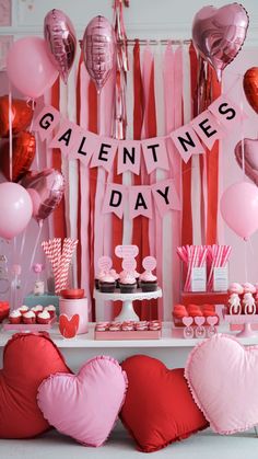 valentine's day dessert table with pink and red balloons