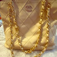 This Is A Beautiful Chanel Bag . It Has A Slight Imperfection That May Be Able To Be Fixed By Chanel Or A Bag Boutique.. I Put A Close Up Photo Of It. It Is Beige Caviar Leather, And Gold Hardware And Gold Chain. The Inside Is In Pretty Good Shape . The Inside Is A Shiny Gold/Beige Material. It Has Small Light Stains That Could Be Fixed/Washed By A Professional. It Is 10000% Authentic. Please Review Photos Before Purchase. Thank You So Much! Happy Holidays Bag Boutique, Close Up Photo, Beige Bag, Small Light, Light Stain, Close Up Photos, Pretty Good, A Bag, Chanel Bag