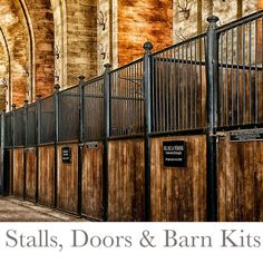 the inside of a building with wooden doors and metal railings on both sides, along with an arched doorway