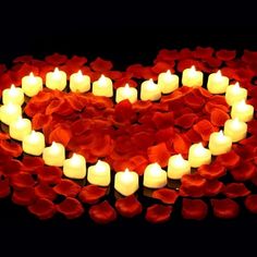 heart shaped candles are arranged in the shape of a heart