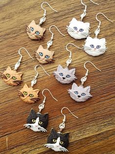 "Kitty faces on nickel free earwire. 1.75\" x 1\"" Cute Cat Design Dangle Earrings, Adjustable Cute Cat Design Earrings, Cute Adjustable Cat Design Earrings, Cute Cat Design Adjustable Earrings, Cute Cat Ears Earrings With Cat Print, Beaded Chandelier Earrings, Beaded Chandelier, Leather Bar, Cat Earrings