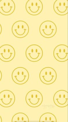 a yellow background with many smiley faces on it