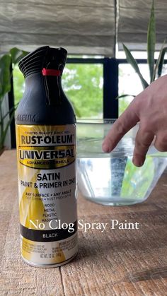 a bottle of rust - oleeum universal stain sitting on a table