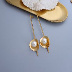 Style: Female Material: Titanium Steel, Imitation Pearl Pearl Type: Uncultured Pearl Color: White Pearl Shape: Round Earring Size:9.5*2.1cm Trendy Gold Metal Pearl Earrings, Metal Pearl Earrings With Plating For Gifts, Metal Plated Pearl Earrings For Gifts, Gift Pearl Earrings With Metal Plating, Gold Alloy Pearl Earrings For Party, Chic Metal Pearl Drop Earrings, Trendy Metal Pearl Drop Earrings, Metal Drop Earrings With Plating, Modern Gold Metal Pearl Earrings