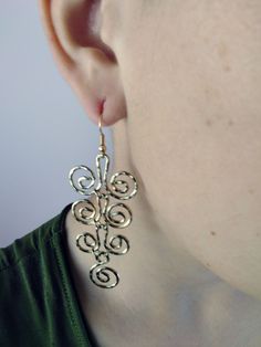 "Spiral is the symbol of the Eternal Development and help us to accept life as it is. Greek spiral earrings Hammered dangle gold or silver plated earrings Geometric spiral earrings Greek jewellery Handmade earrings Materials: - French hypoallergenic earwires, gold or silver plated free of lead and nickel. - Hammered handcrafted metallic gold or silver plated wire, free of lead and nickel. Dimensions: - Style 1 and 2 total lenght 3.15\" (8cm) and width 1.18\" (3cm) - Style 3 and 4 total lenght 2.75\" (7cm) and width 1.18\" (3cm)" Gold Swirl Metal Earrings, Silver Spiral Brass Earrings, Spiral-shaped Pierced Metal Jewelry, Gold Swirl Nickel-free Earrings, Greek Jewellery, Geometric Spiral, Greek Jewelry, Spiral Earrings, Earrings Geometric