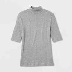 Take your casual looks to the next level with this Ribbed Short-Sleeve Mock Turtleneck T-Shirt from A New Day™. The short-sleeve tee is cut from midweight fabric with added spandex for comfortable wear from day to night and season to season, while the 2 x 2 rib-knit construction adds a touch of texture. Tailored in a flattering fitted silhouette, the short-sleeve tee with a mock turtleneck is easy to dress up or down for a variety of occasions. A New Day™: Style that goes wherever you do. Gray Half Sleeve Top For Fall, Fall Half Sleeve Relaxed Fit T-shirt, Relaxed Fit Half Sleeve T-shirt For Fall, Gray Cotton Turtleneck Top, Casual High Neck Stretch T-shirt, Casual Fitted Mock Neck Top With Short Sleeves, Spring Solid Turtleneck T-shirt, Casual High Neck T-shirt, Casual High-neck T-shirt