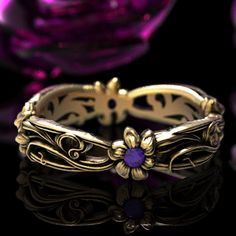 See all variations of this ring: www.etsy.com/shop/doveandbunting?search_query=5108 A flowing Art Nouveau floral pattern. Four dainty flowers, with Amethysts at their center, are connected through intricately flowing leaves. A simple but elegant design, the graceful and sweeping curves are sure to dazzle you or your lover! Cast in solid gold (yellow, white or rose) or platinum, this ring is made of 100% recycled metal. We make this ring in a polished with patina finish to help the details stand Art Nouveau Floral Pattern, Flower Wedding Band, Amethyst Art, Flower Wedding Ring, Wedding Band Unique, Amethyst Flower, Art Nouveau Earring, Sterling Silver Owl, Art Nouveau Flowers