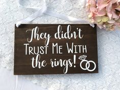 a wooden sign that says they didn't trust me with the rings