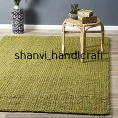 a green rug with the words this image appears to be in front of a chair