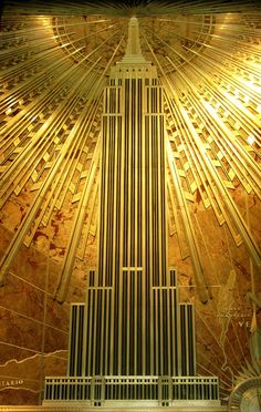 the empire building in new york city is lit up with gold and white stripes on it