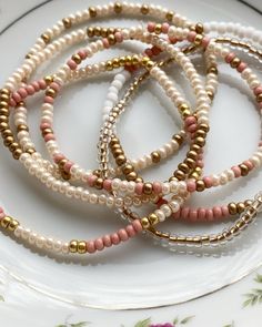 5-EA  3mm seed bead bracelets (mix of matte gold, rose, cream and white) Elastic Seed Bead Bracelets Diy, Gold Seed Bead Bracelet, Bracelet Color Combos Beads, Seed Bead Bracelets Ideas Color Combos, Seed Bead Bracelets Ideas, Seed Bead Bracelets Diy, Boho Bracelets Stack, Small Bead Bracelet, Homemade Bracelets