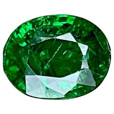 an oval green diamond on a white background