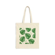 "This 100% cotton tote bag is perfect for everyday use! The fun pattern makes running your errands a little more enjoyable.  Details: - Size: 15\" x 16\" - Material: 100% cotton canvas, heavy fabric (12 oz/yd² (406.9 g/m - Sewn-in label" Casual Cotton Reusable Bags, Trendy Green Cotton Bags, Casual Canvas Bag With Graphic Print, Casual Green Canvas Gift Bag, Casual Green Cotton Canvas Bag, Green Cotton Canvas Bag For Everyday Use, Green Cotton Canvas Bag For Everyday, Green Cotton Tote Bags, Green Cotton Shopping Bags