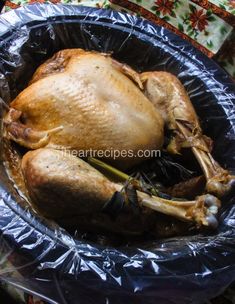 a whole chicken is wrapped in plastic and ready to be cooked on the stove top