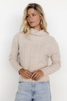 Classic sweater for when the weather gets chilly Neutral light beige color Knit material has stretch Braid and zigzag pattern throughout Turtleneck Ribbing at neck, sleeve cuffs, and hem 72% Acrylic, 25% Nylon, 3% Spandex Trina is 5'6, cup size 32D, size 2 and is wearing size S Beige Turtleneck, Turtleneck Style, Baltic Born, Zigzag Pattern, Neck Cream, Classic Sweater, Zig Zag Pattern, Beige Sweater, Sweater Design