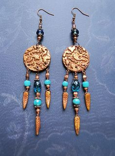 These dangle earrings present a pair of focal textured copper finish medallions in polymer clay, complimented with dropping stringed glass beads in blue, turquoise and copper hues.  The drop (total) length is 14 cm x 3 cm wide (~5,5" x 1"). Bleu Turquoise, Copper Finish, Bead Jewellery, Blue Turquoise, Favorite Jewelry, Jewelry Earrings Dangle, Glass Beads, Dangle Drop Earrings, Polymer Clay