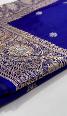 a blue and gold cloth is laying on the table